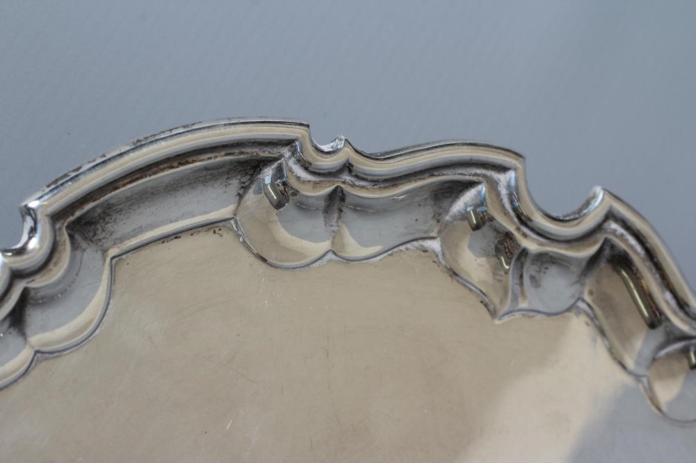AN EDWARDIAN SILVER SALVER by James Dixon & Sons Ltd. Image