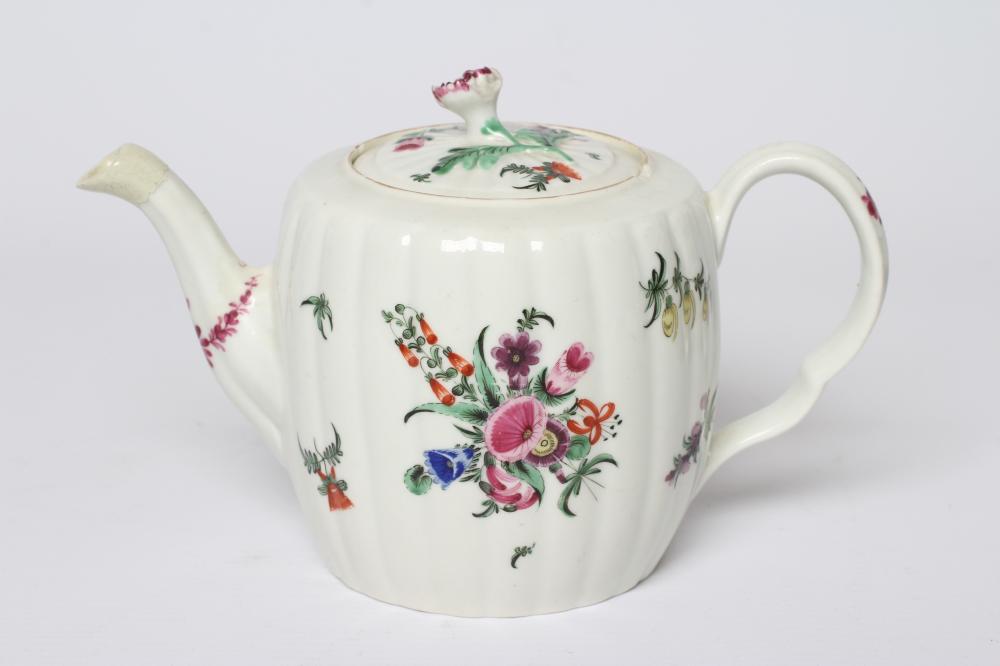 A WORCESTER PORCELAIN RIBBED BARREL TEAPOT AND COVER, c.1775, painted in colours with bouquets and Image