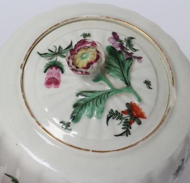 A WORCESTER PORCELAIN RIBBED BARREL TEAPOT AND COVER, c.1775, painted in colours with bouquets and Image