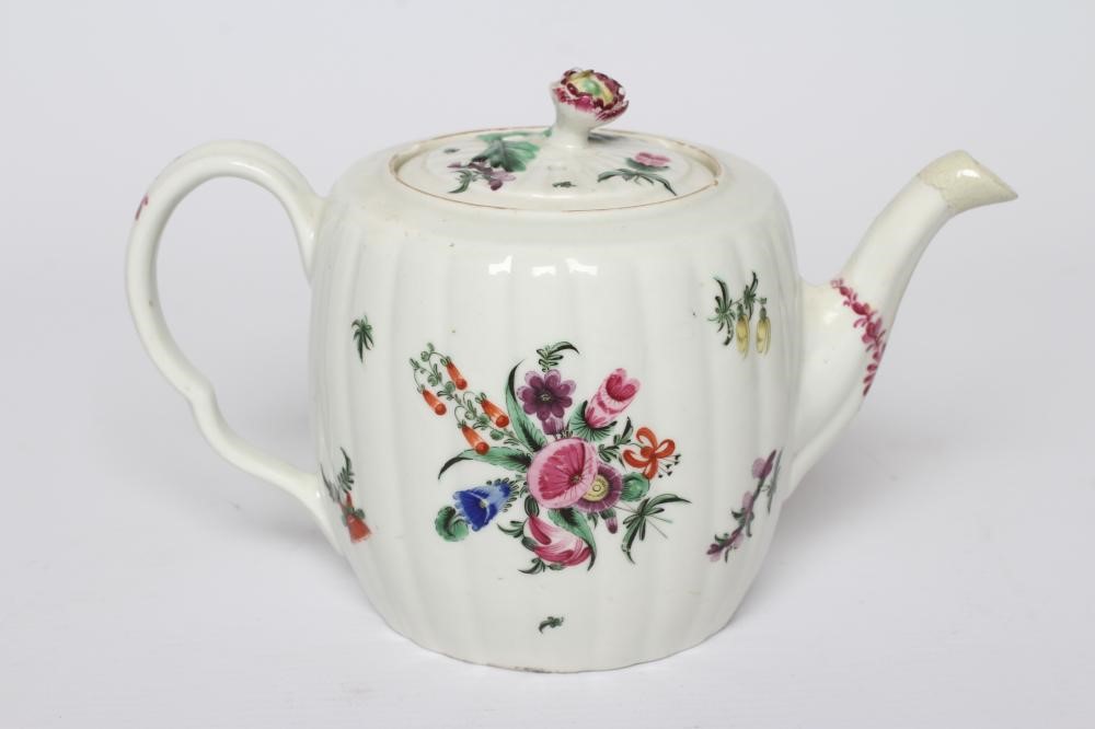A WORCESTER PORCELAIN RIBBED BARREL TEAPOT AND COVER, c.1775, painted in colours with bouquets and Image