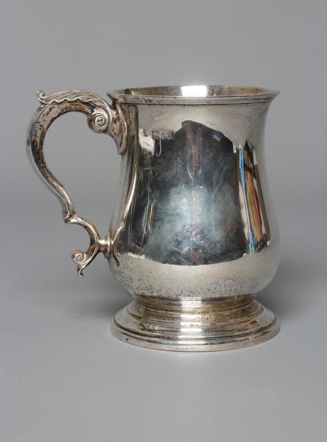 AN EDWARDIAN SILVER MUG by Wakely & Wheeler, London 1904, of baluster form with acanthus leaf Image