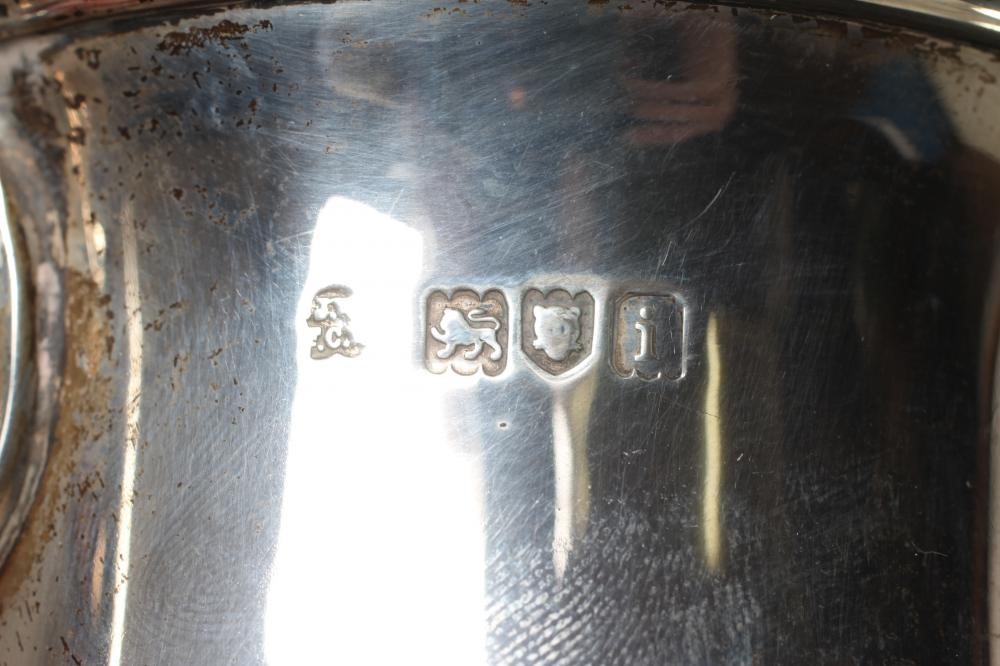 AN EDWARDIAN SILVER MUG by Wakely & Wheeler, London 1904, of baluster form with acanthus leaf Image