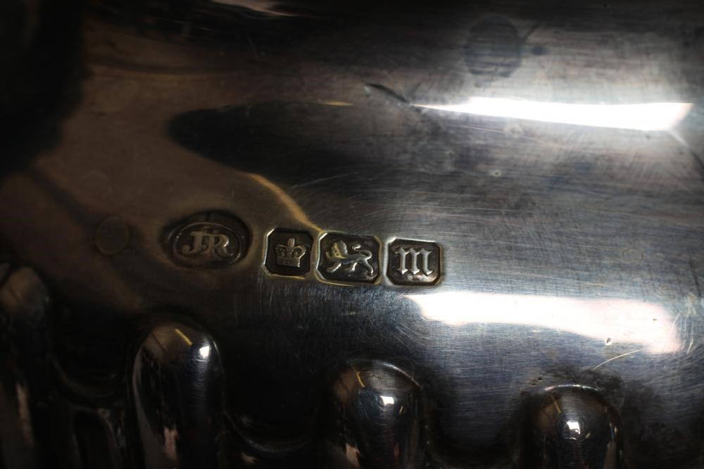 AN EDWARDIAN SILVER MATCHED THREE PIECE TEA SERVICE by John Round & Son Ltd. Image