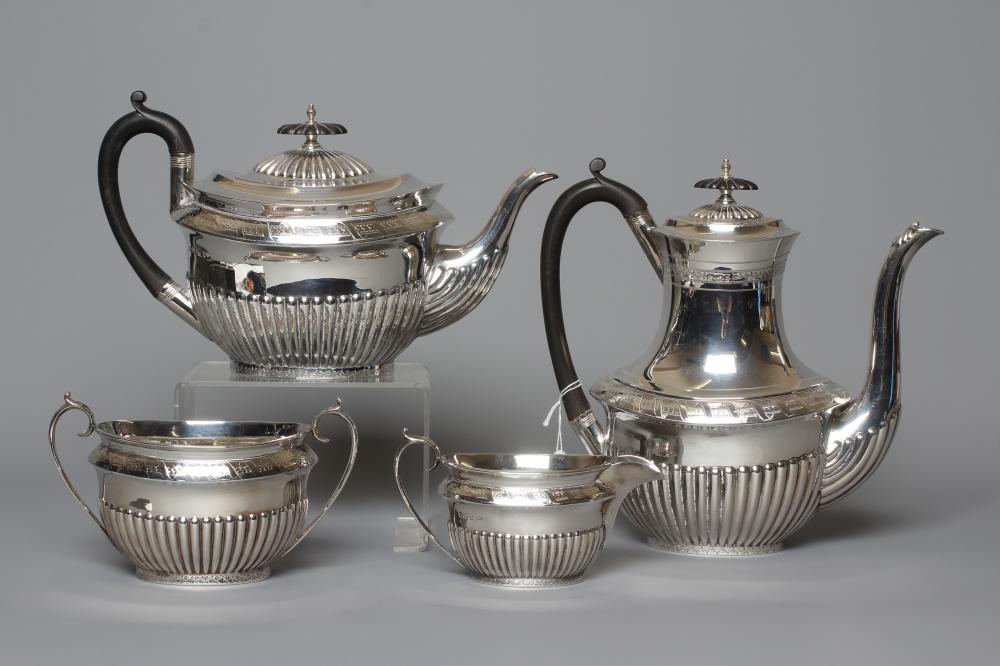 A COMPOSITE LATE VICTORIAN/EDWARDIAN SILVER FOUR PIECE TEA AND COFFEE SERVICE by Walker & Hall Image