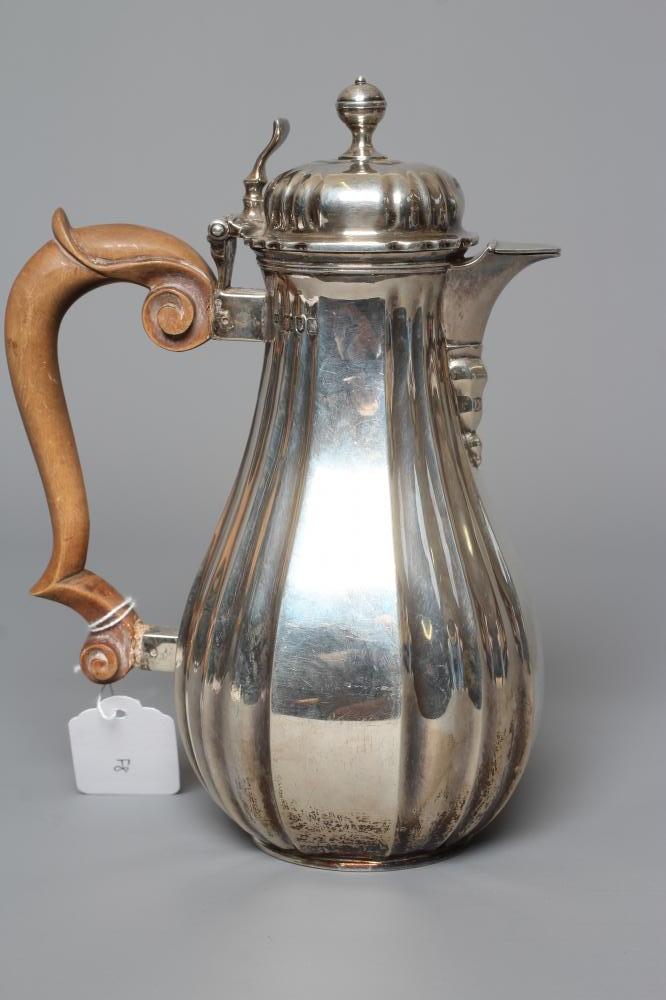 AN EDWARDIAN SILVER HOT MILK JUG by Lambert & Co. Image