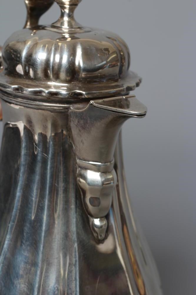 AN EDWARDIAN SILVER HOT MILK JUG by Lambert & Co. Image