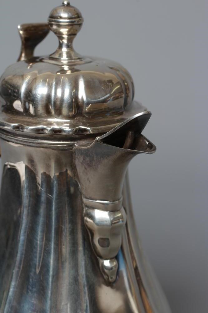 AN EDWARDIAN SILVER HOT MILK JUG by Lambert & Co. Image