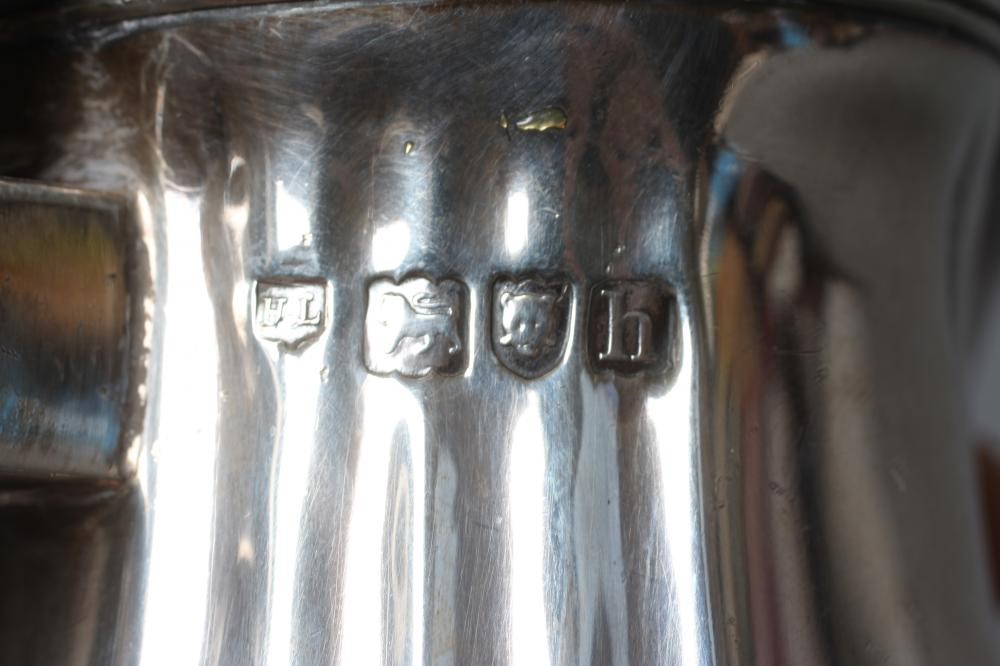 AN EDWARDIAN SILVER HOT MILK JUG by Lambert & Co. Image