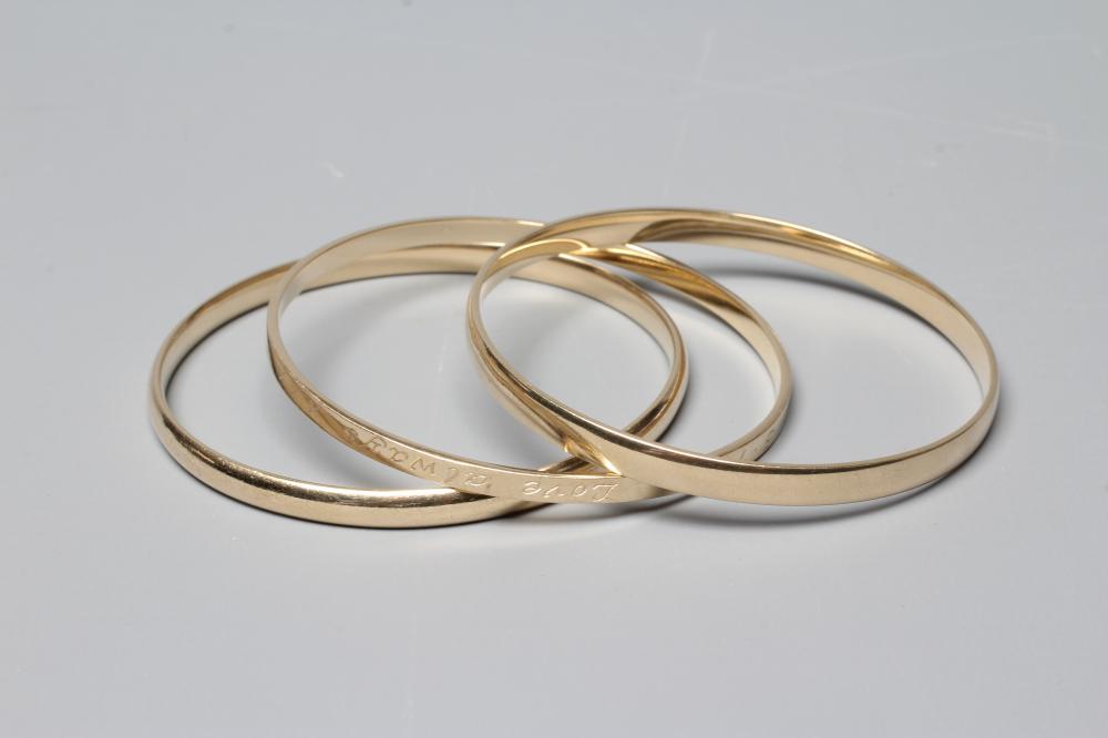 TWO 9CT GOLD BANGLES Image