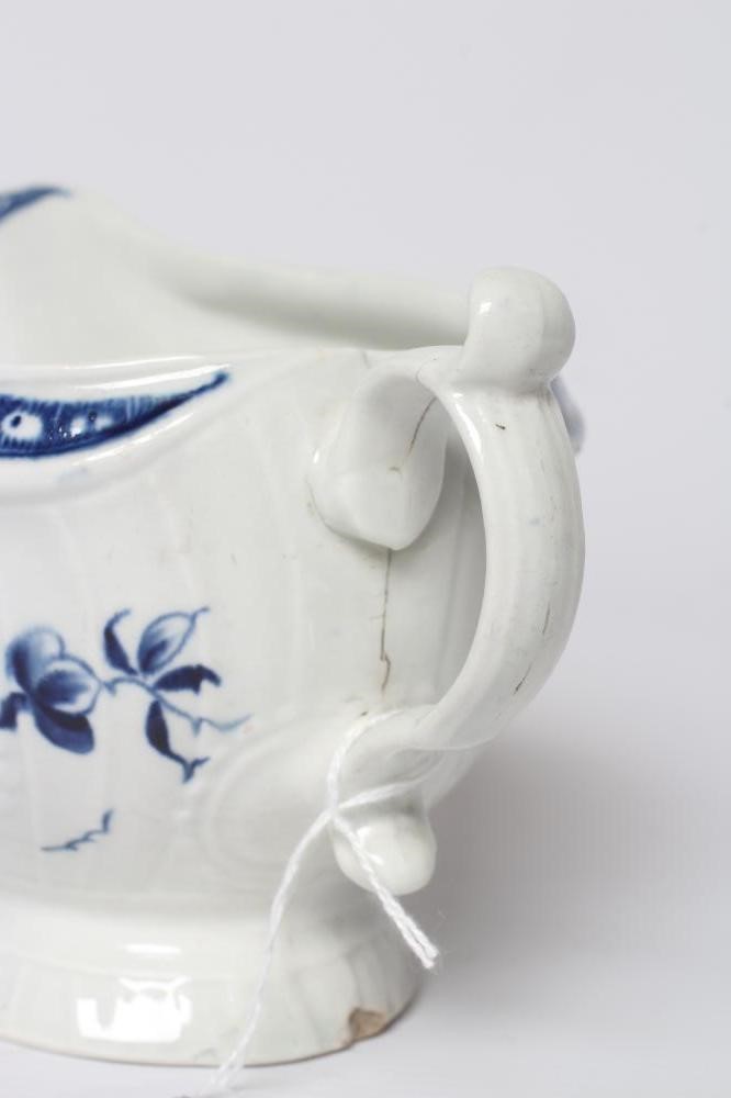 A WORCESTER PORCELAIN STRAP FLUTE FLORAL SAUCEBOAT, c.1780, of pleat moulded shaped oval form, Image