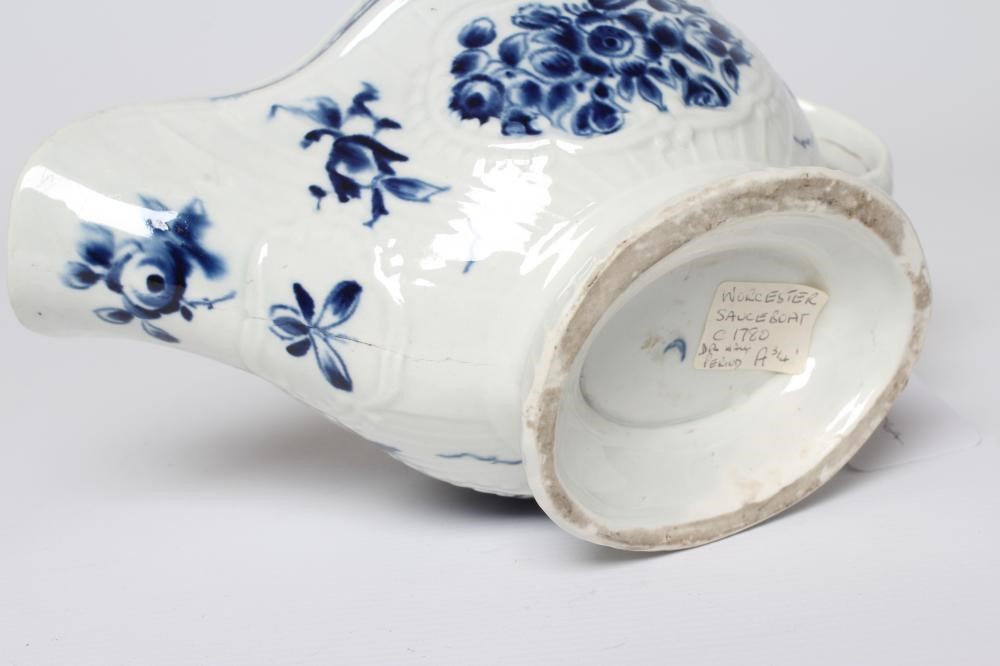 A WORCESTER PORCELAIN STRAP FLUTE FLORAL SAUCEBOAT, c.1780, of pleat moulded shaped oval form, Image