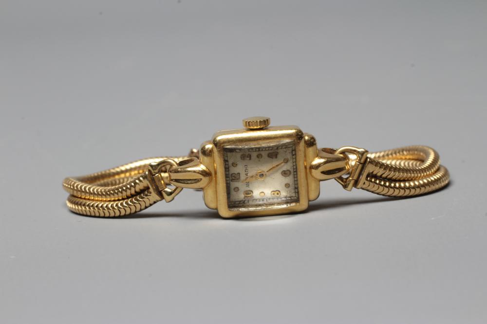 A LADY'S 18CT GOLD CASED MOVADO WRISTWATCH Image
