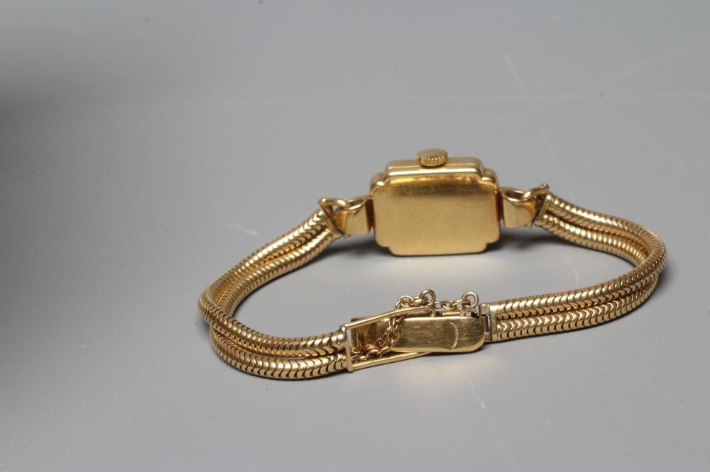 A LADY'S 18CT GOLD CASED MOVADO WRISTWATCH Image