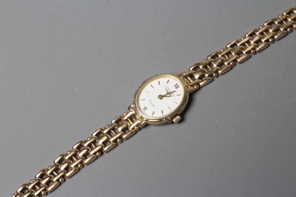 A LADY'S LONGINES WRISTWATCH, stamped 375, the oval white dial with gilt metal batons, the quartz Image