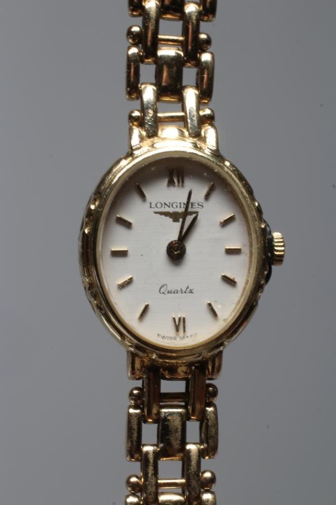 A LADY'S LONGINES WRISTWATCH, stamped 375, the oval white dial with gilt metal batons, the quartz Image