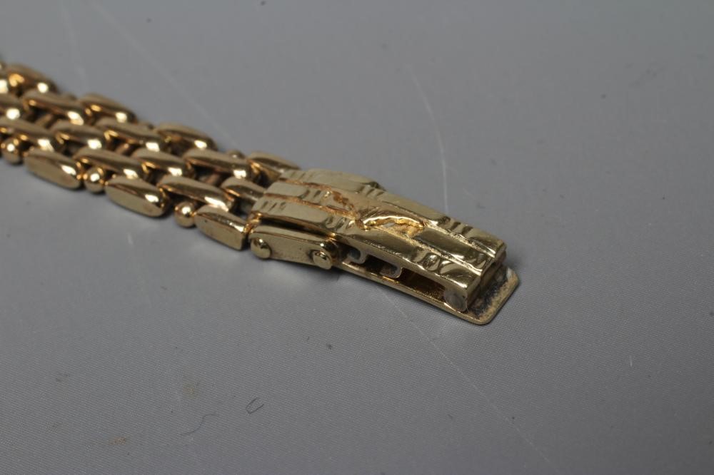 A LADY'S LONGINES WRISTWATCH, stamped 375, the oval white dial with gilt metal batons, the quartz Image