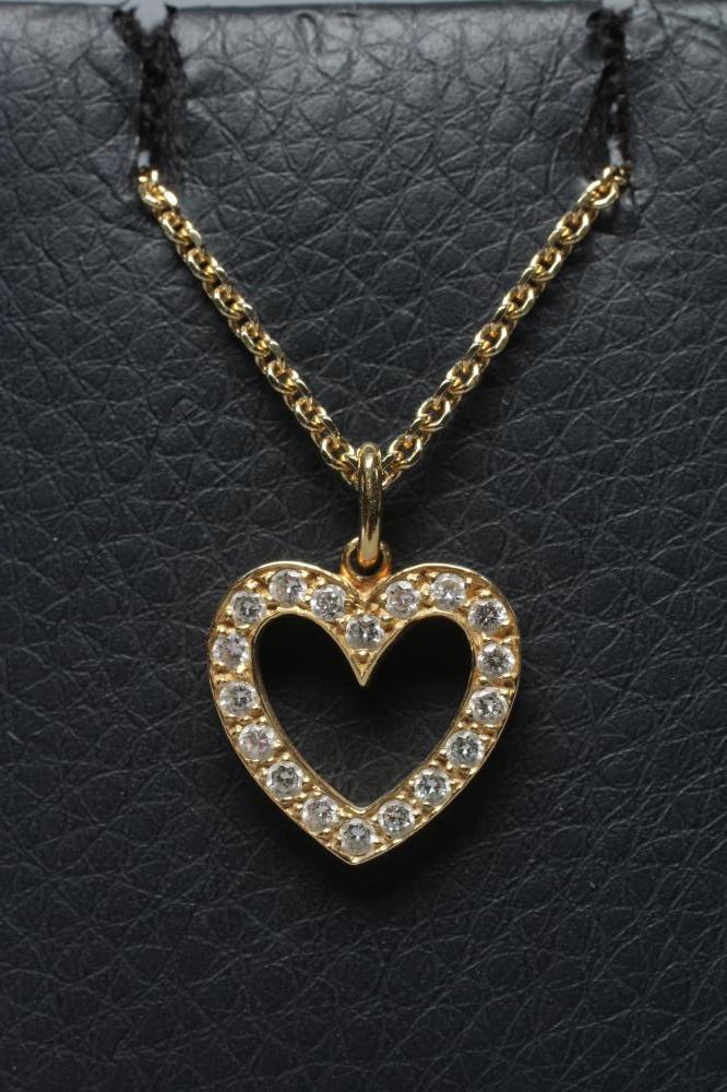 A DIAMOND HEART PENDANT, the plain open panel point set with numerous small round brilliants, London Image