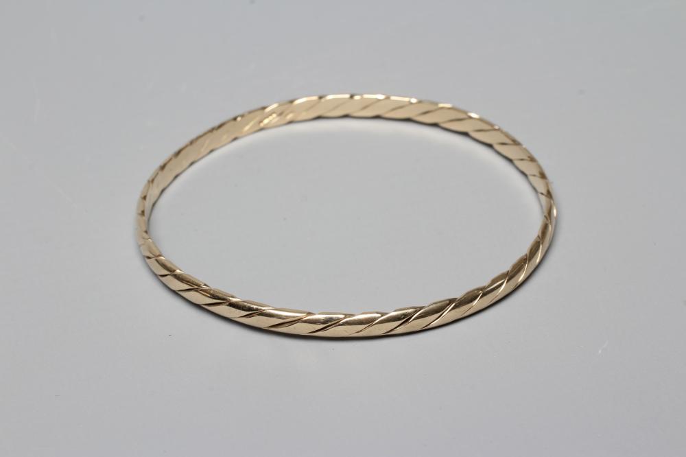 A 9CT GOLD PLAIN TWIST BANGLE, Sheffield 1987, sponsor MJM, 14.7g Image