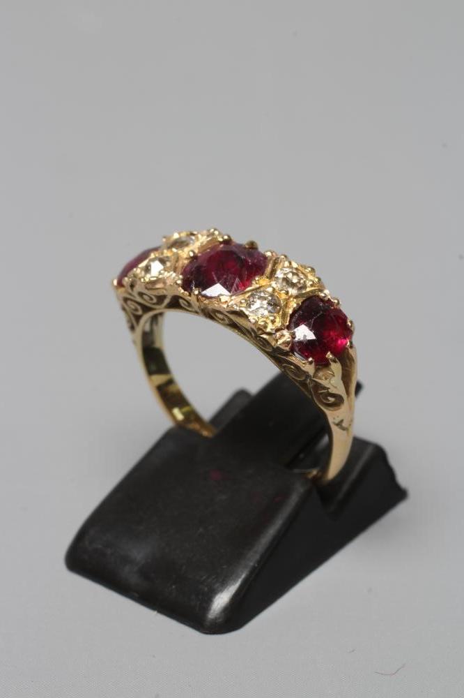 A LATE VICTORIAN THREE STONE RUBY RING Image
