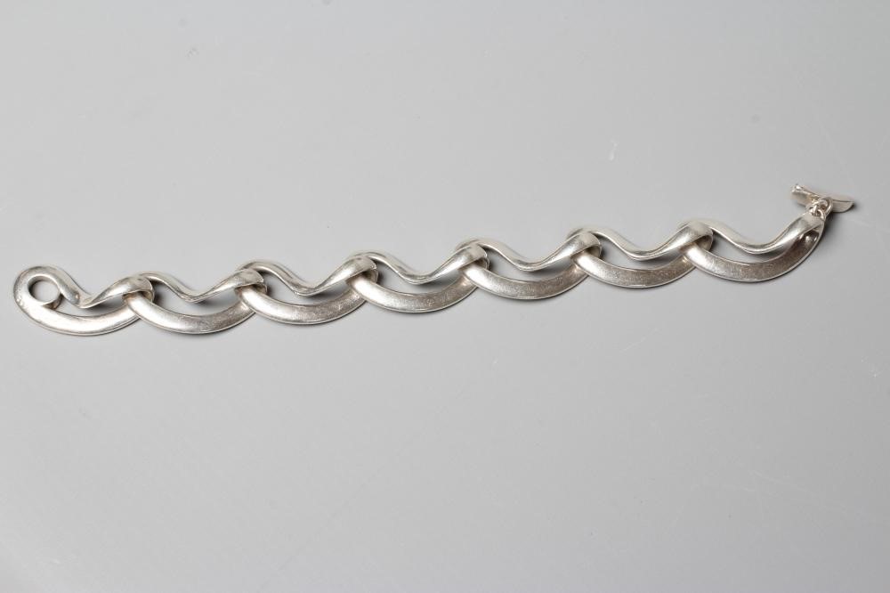 A GEORG JENSEN SILVER INFINITY BRACELET designed by Regitze Overgaard, No. 452, London 2011, 74.8g Image