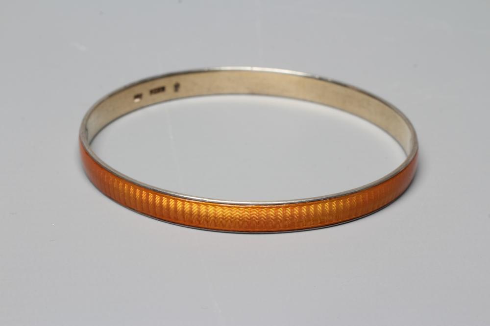 A NORWEGIAN SILVER GILT BANGLE BY MARIUS HAMMER with orange guilloche enamelling, stamped 925S, MH Image