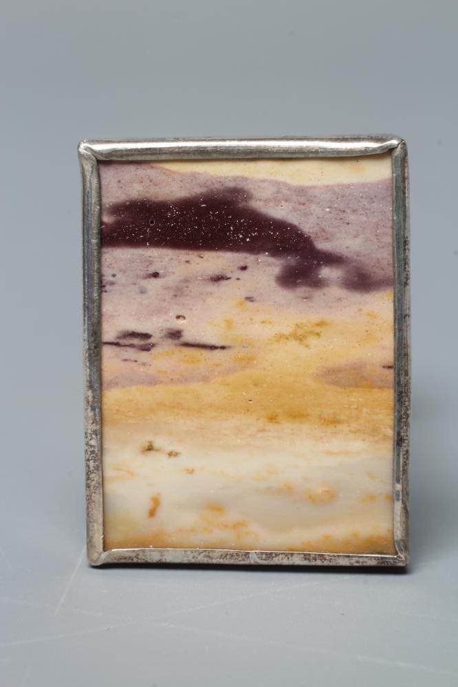 ANNO DOMINI - an Ann O'Donnell silver mounted oblong polished 'landscape agate' brooch, London 1979, Image