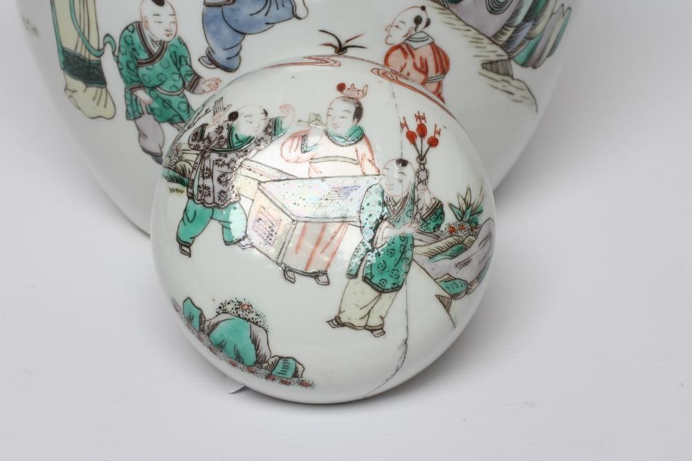 A CHINESE PORCELAIN FAMILLE VERTE LARGE JAR AND COVER painted with four ladies and eight children at Image