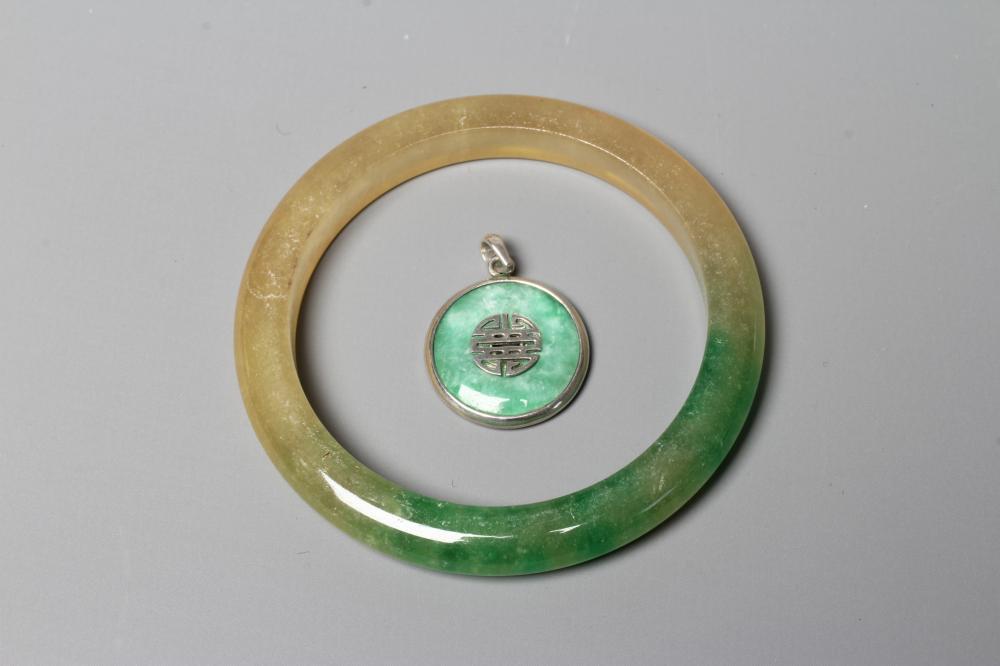 A CHINESE POLISHED JADE BANGLE of D form, 37g, together with a silver mounted jade Shou pendant, Image