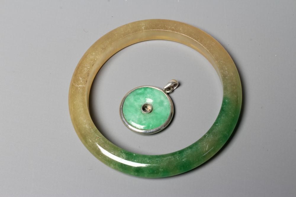 A CHINESE POLISHED JADE BANGLE of D form, 37g, together with a silver mounted jade Shou pendant, Image