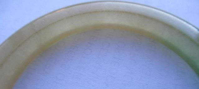 A CHINESE POLISHED JADE BANGLE of D form, 37g, together with a silver mounted jade Shou pendant, Image