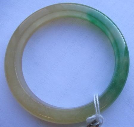 A CHINESE POLISHED JADE BANGLE of D form, 37g, together with a silver mounted jade Shou pendant, Image
