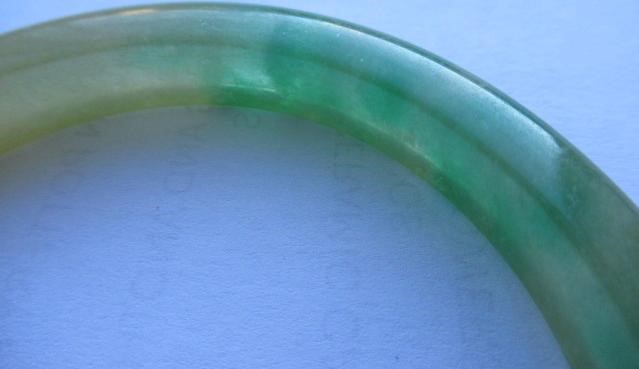 A CHINESE POLISHED JADE BANGLE of D form, 37g, together with a silver mounted jade Shou pendant, Image