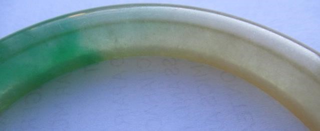 A CHINESE POLISHED JADE BANGLE of D form, 37g, together with a silver mounted jade Shou pendant, Image