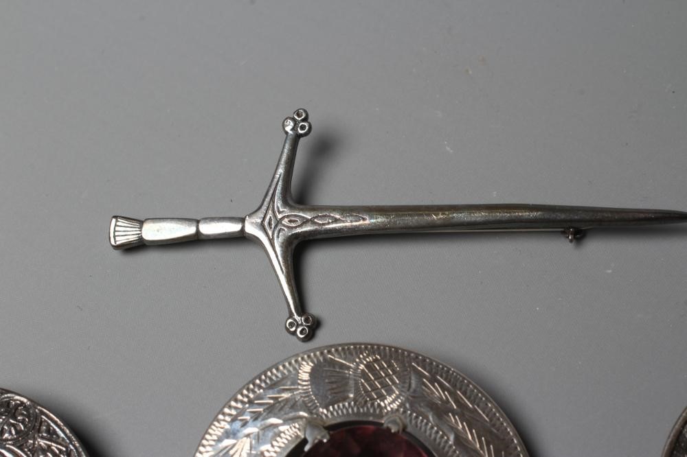 A COLLECTION OF SCOTTISH SILVER JEWELLERY comprising a John Hart Iona Graham clan badge Image