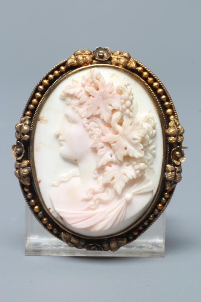 A VICTORIAN PINK AND WHITE SHELL CAMEO carved in high relief with the head and shoulders portrait of Image
