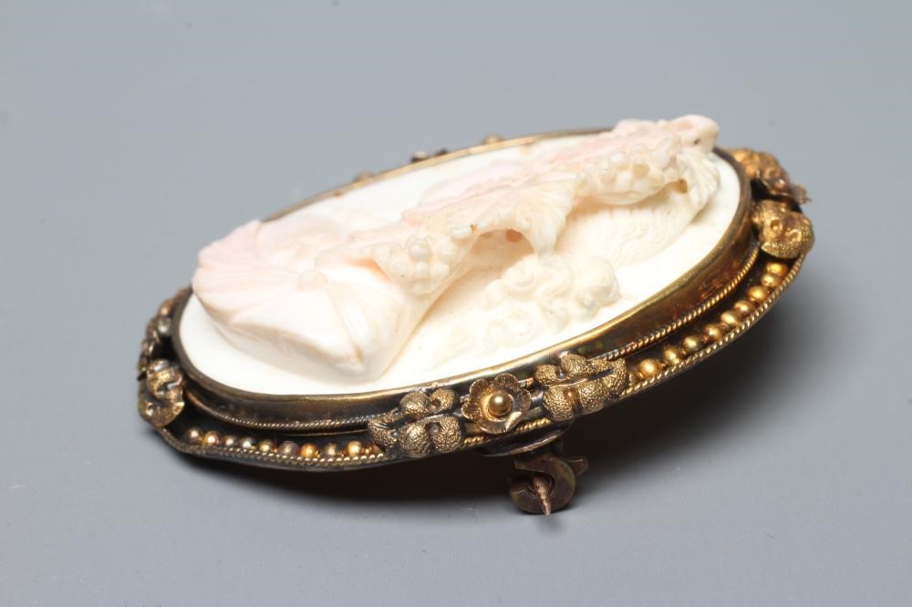 A VICTORIAN PINK AND WHITE SHELL CAMEO carved in high relief with the head and shoulders portrait of Image