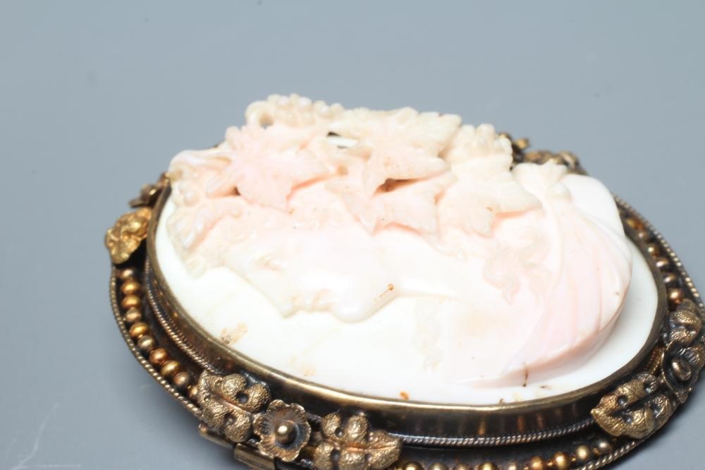 A VICTORIAN PINK AND WHITE SHELL CAMEO carved in high relief with the head and shoulders portrait of Image