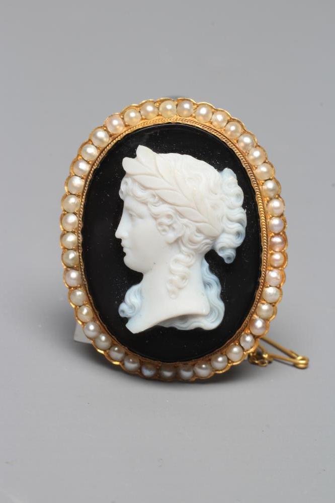 A JASPER CAMEO carved with the head and shoulders of a young girl wearing a wreath in her hair on a Image
