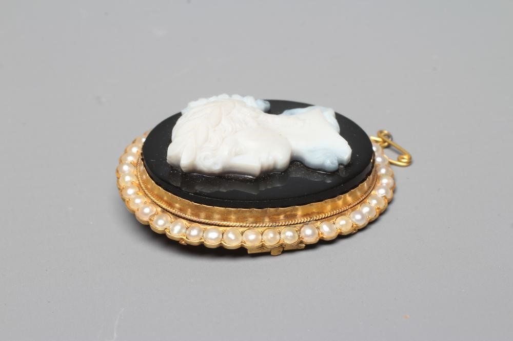 A JASPER CAMEO carved with the head and shoulders of a young girl wearing a wreath in her hair on a Image