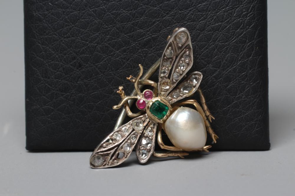 A VICTORIAN INSECT BROOCH with two ruby cabochon eyes, square cut emerald thorax and blister pearl Image