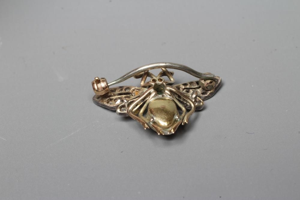 A VICTORIAN INSECT BROOCH with two ruby cabochon eyes, square cut emerald thorax and blister pearl Image