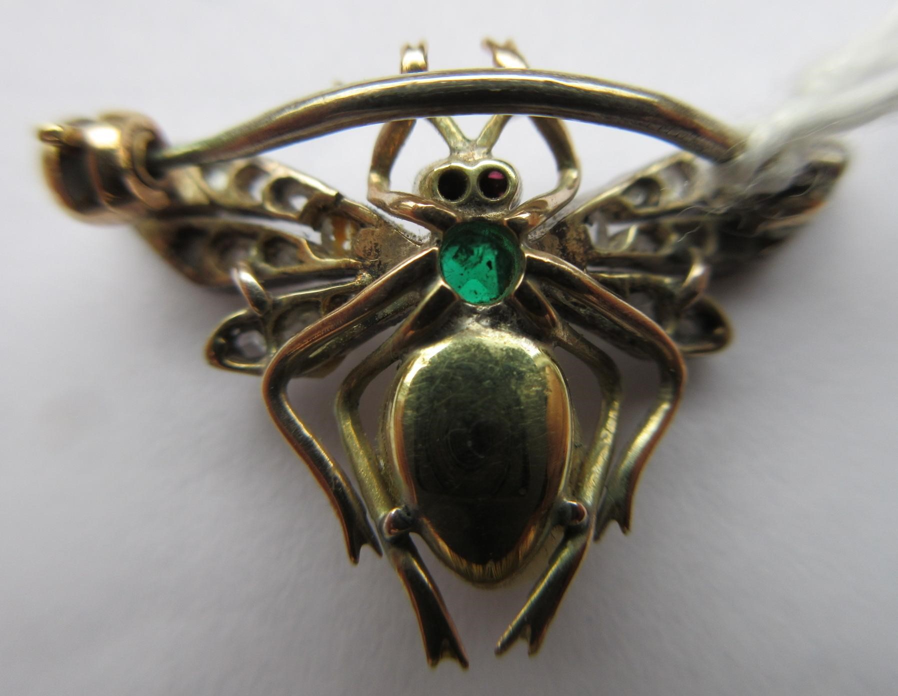A VICTORIAN INSECT BROOCH with two ruby cabochon eyes, square cut emerald thorax and blister pearl Image
