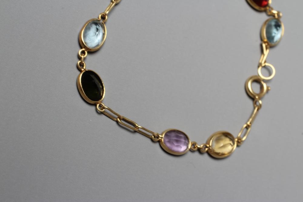 A MULTI-GEM BRACELET, the four pairs of facet cut coloured stones including garnet, aquamarine and Image