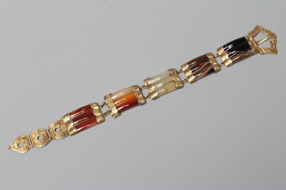 A VICTORIAN SCOTTISH POLISHED AGATE BRACELET, the five ribbed panels with engraved gilt metal mounts Image