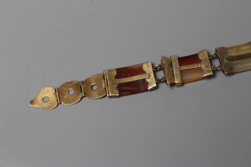 A VICTORIAN SCOTTISH POLISHED AGATE BRACELET, the five ribbed panels with engraved gilt metal mounts Image