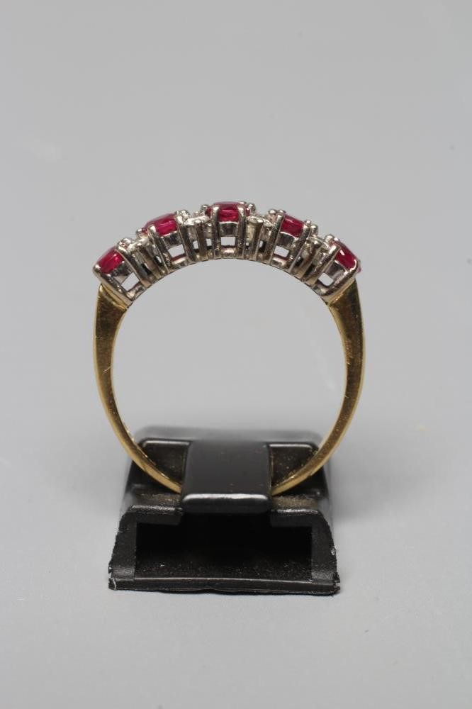 A RUBY AND DIAMOND HALF HOOP RING Image