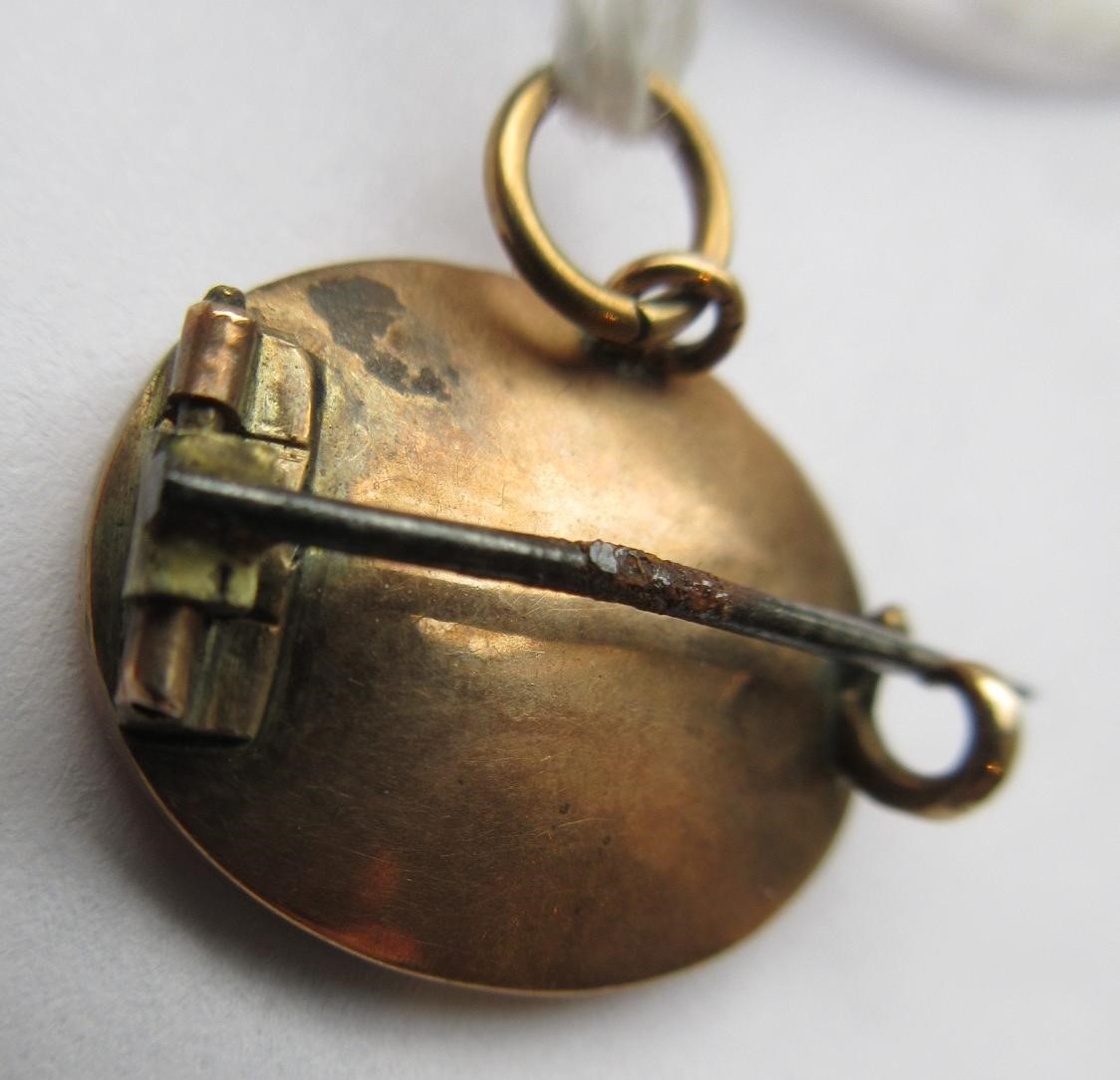 A VICTORIAN MICRO-MOSAIC OVAL MINIATURE BROOCH centred by a butterfly on a black ground Image