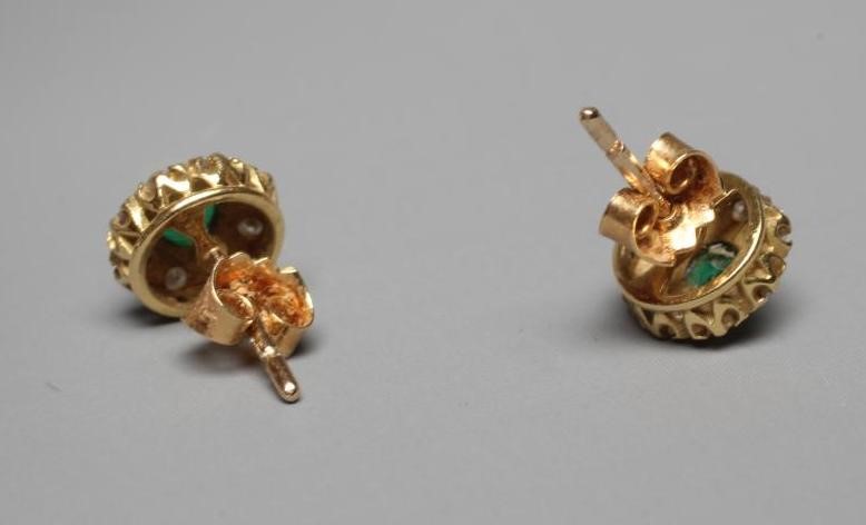 A PAIR OF EMERALD AND DIAMOND CLUSTER EAR STUDS Image