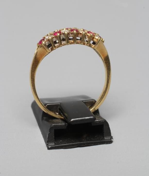 A RUBY AND DIAMOND HALF HOOP ETERNITY RING Image
