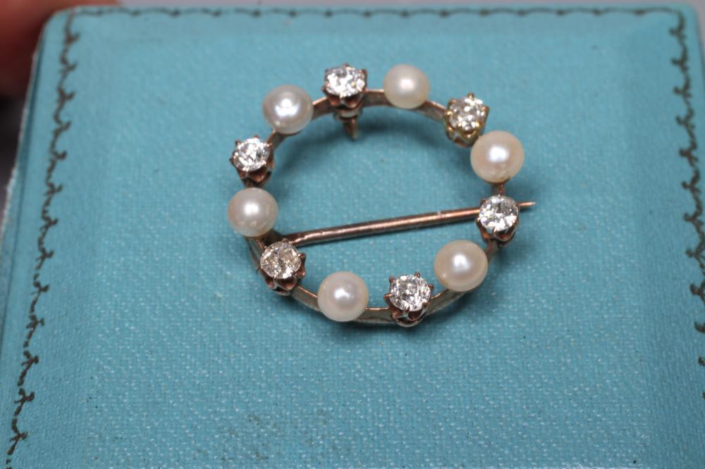 A LATE VICTORIAN DIAMOND AND PEARL CIRCLET BROOCH Image